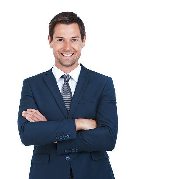 Cropped portrait of a handsome businessman standing with his arms folded isolated on white